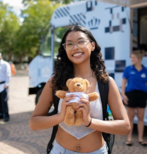 Female Latina student by fountain